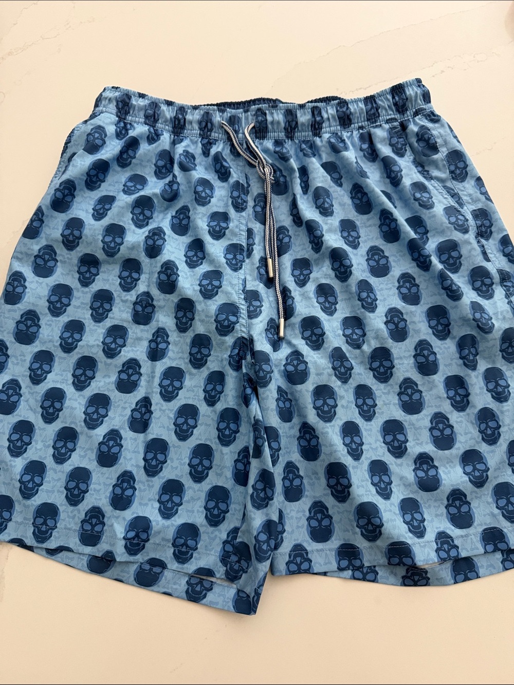 Peter Millar Light Blue Swim Trunks with Navy Skull Print